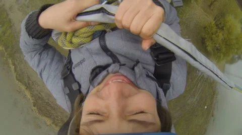 Girl jumping from the bridge - view from the camera on the helmet Stock Footage 32845455