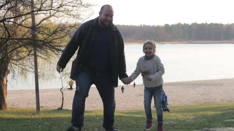 Girl is jumping with dad Video stock 74618929