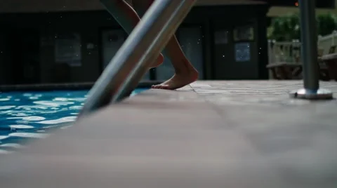 Girl jumping in pool Stock Footage 52236947