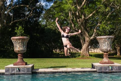 Girl Jumping Pool Stock Photos