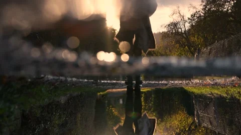 Girl jumping in a puddle of mudd Stock Footage 142309058
