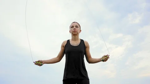 A girl jumping on a rope Stock Footage 110841489