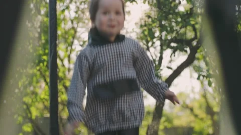 Girl jumping on a trampoline Stock Footage 200727029