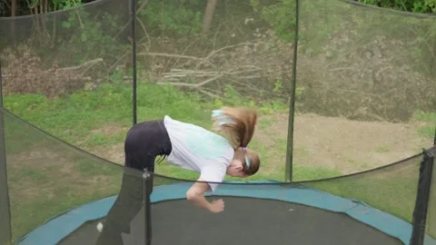 A girl is jumping on a trampoline Stock-Footage 343722066