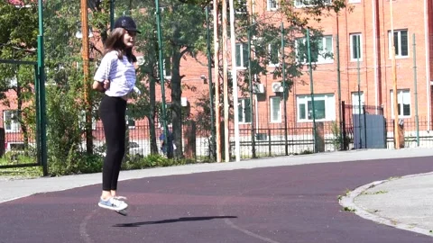 Girl  jumping on a treadmill Stock Footage 138699800
