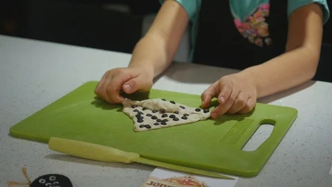 Girl in kitchen during cooking classes making dough cookie Stock Footage 106393145