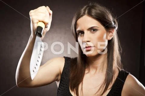 Girl with knife Stock Photos