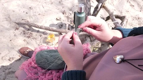 A girl knits clothes from wool Stock Footage 309233254