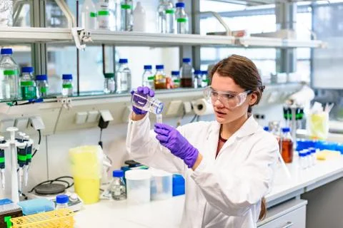 Girl in laboratory preparing solution or vaccine Stock Photos