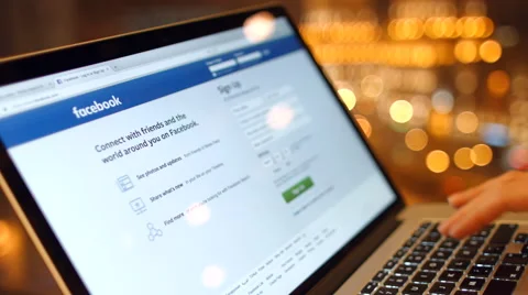 The girl on the laptop is gaining a password, register to log into Facebook. Video stock 59373659