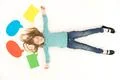 The girl lay on the floor near the dialog signs. View from above Photo