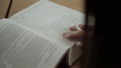 Girl leafing through a book Stock Footage 73365261