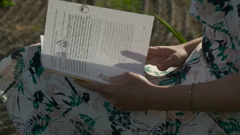 Girl leafing through a book Stock Footage 131109512