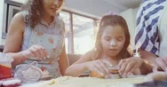 Girl Learning To Cut Cookies With Her Mother And Granny 4K 4K Stock Footage