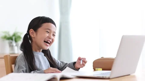 Girl Learning Online on a Computer Stock Footage 333352731