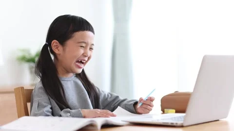 Girl Learning Online on a Computer Stock Footage 333352734
