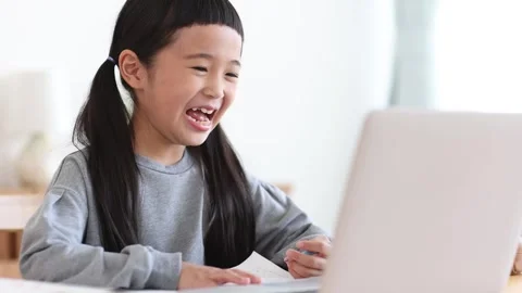 Girl Learning Online on a Computer Stock Footage 333352739
