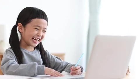 Girl Learning Online on a Computer Stock Footage 333352742