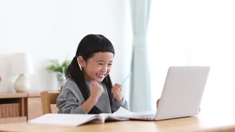 Girl Learning Online on a Computer Stock Footage 333352772