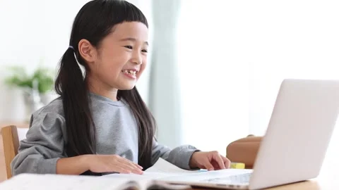 Girl Learning Online on a Computer Stock Footage 333352783