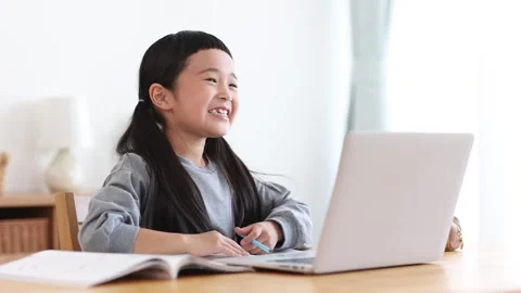 Girl Learning Online on a Computer Stock Footage 333352790