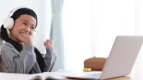 Girl Learning Online on a Computer Stock Footage 333352801