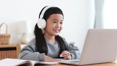 Girl Learning Online on a Computer Stock Footage 333352803