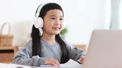 Girl Learning Online on a Computer Stock Footage 333352815