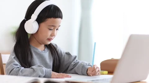 Girl Learning Online on a Computer Stock Footage 333352818