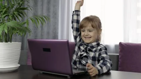 Girl learning online lessons using digital laptop computer. Distance education Stock Photos