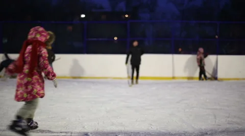 Girl learning to skate and falls on the ice Stock Footage 59142538