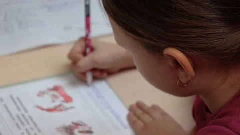 The girl learns lessons at home Stock Footage 128753452