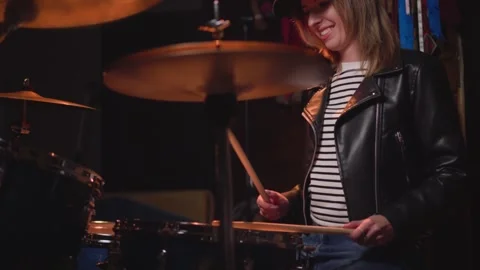 A girl learns to play the drums Stock Footage 290764686