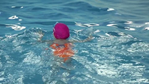 Girl learns to swim Stock Footage 70819593