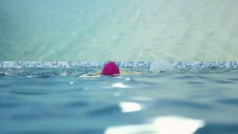 Girl learns to swim in the pool Stock Footage 70818960