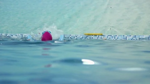 Girl learns to swim in the pool Stock Footage 70819606