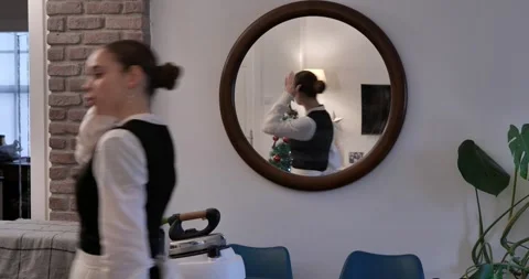Girl leaving after checking mirror Stock Footage 327845002