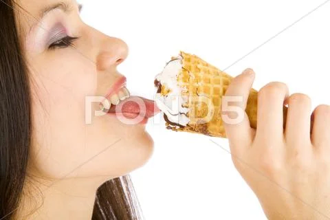 Girl licking an ice-cream Stock Photos