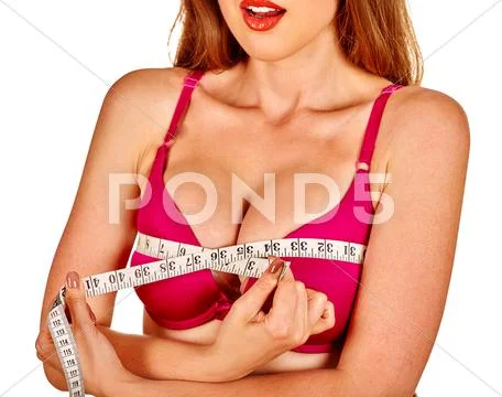 Girl in lingerie measures her breast measuring tape. Stock Photos