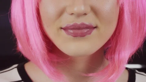 Girl with the lips of the devil. Young beautiful girl with pink hair. Video stock 121320360