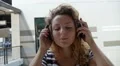 Girl Listening Music in Headphones Outdoors. Slow Motion. HD Footage