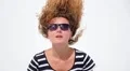 Girl Listening Music in Headphones on White Background. Slow Motion. HD Footage