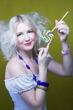 Girl with lollipop Stock Photos