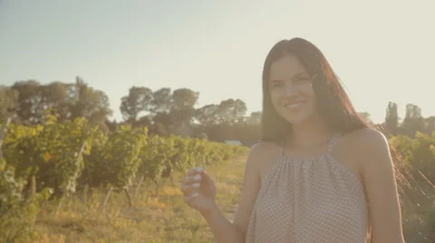 Girl with long hair walking along the rows of vineyards Stock Footage 59383960