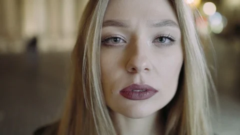 The girl is looking at the camera. The big plan. Evening Rome. Portrait. Stock-Footage 104747860
