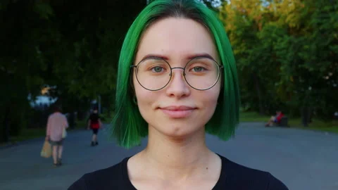 Girl looking at camera, smiling, blinking Stock-Footage 165113347