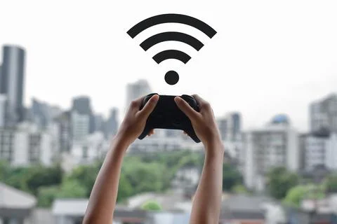 Girl looking for connection with a remote controller of a video game Stock Photos