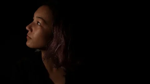 Girl looking up Stock Footage 121137735
