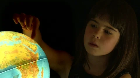 GIRL LOOKING AT GLOBE Stock Footage 10828167