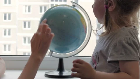 Girl looking at the globe Stock Footage 85545820